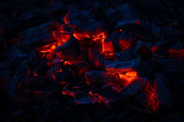 istock Chips of charcoal in which a fire flares up. 1389346300