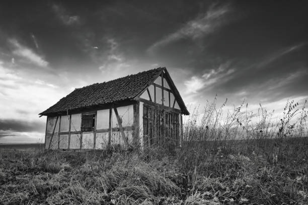 beautiful half-timbered barn an a field in germany