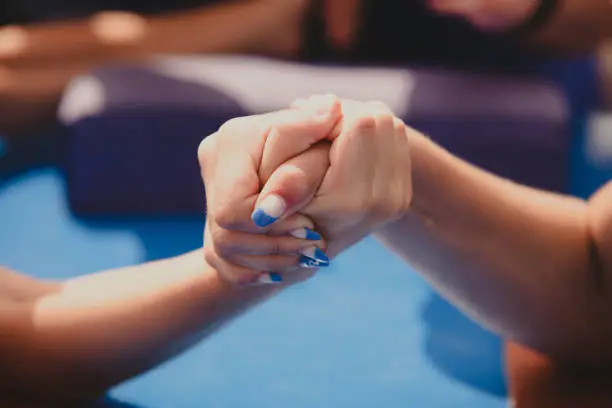 Amateur competitions in arm wrestling. The girls' hands are large.