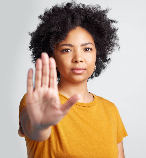 istock Studio shot of a woman gesturing to stop while standing against a grey background 1389349382