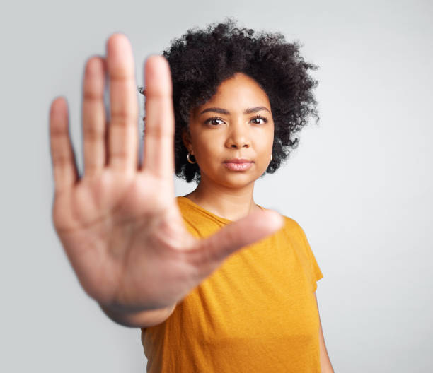 istock Studio shot of a woman gesturing to stop while standing against a grey background 1389349383