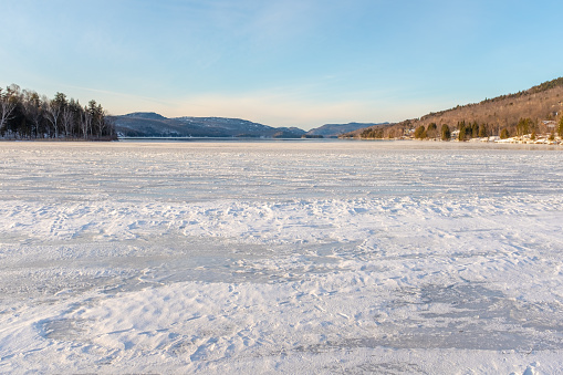 A partly frozen lake in Mont-Tremblant, Quebec, Canada. Taken at the end of a sunny day
