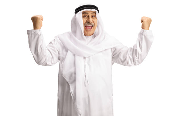 Excited arab man with wearing dishdasha and gesturing happiness isolted on white background