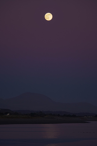 Moonrise over the snowdonia mountain range from Pen Llŷn