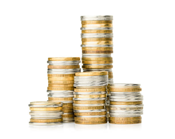 stacks of coins stacks of coins on a white isolated background stacking stock pictures, royalty-free photos & images