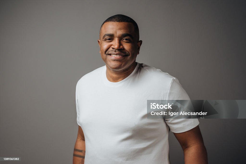 Portrait of a man wearing white t-shirt in studio African-American Ethnicity Stock Photo