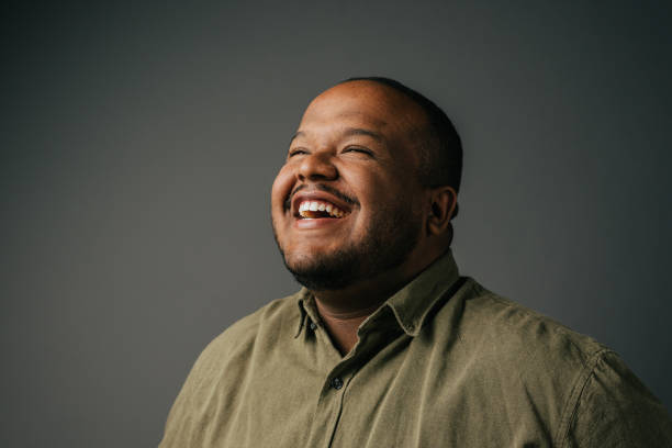 portrait of a smiling man in the studio - portrait human face men overweight imagens e fotografias de stock