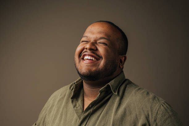 istock Portrait of a smiling man in the studio 1389361433