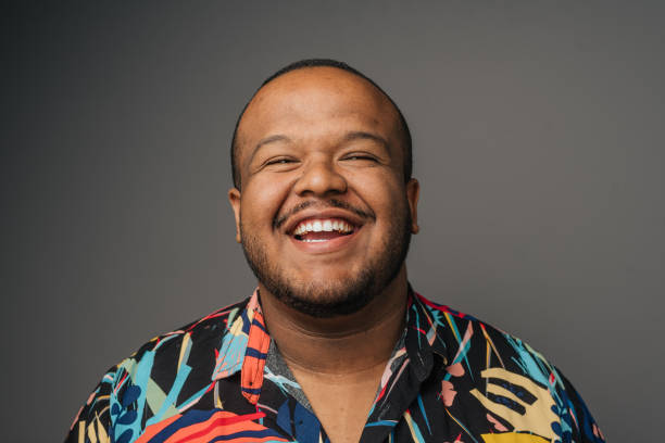 istock Smiling man wearing colorful outfit in studio 1389361438