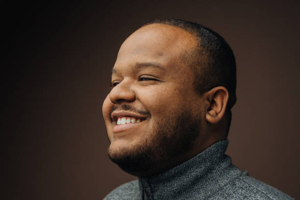 istock Portrait of a black man daydreaming 1389361495