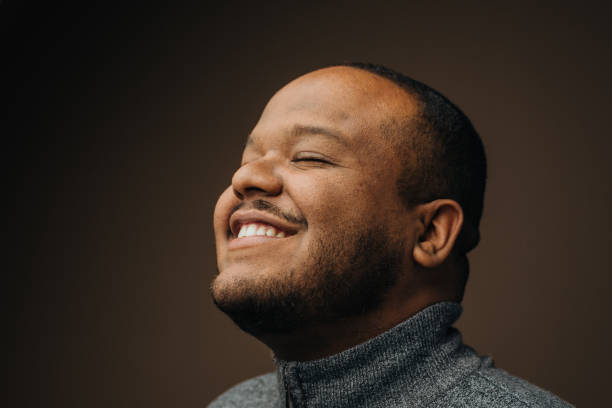 istock Portrait of a black man daydreaming 1389361497