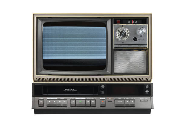 istock Old TV with noise and interference on the screen and VCR isolated on white background. 1389362515