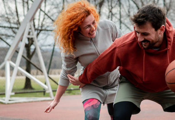 istock Love Couple Playing Basketball 1389362883