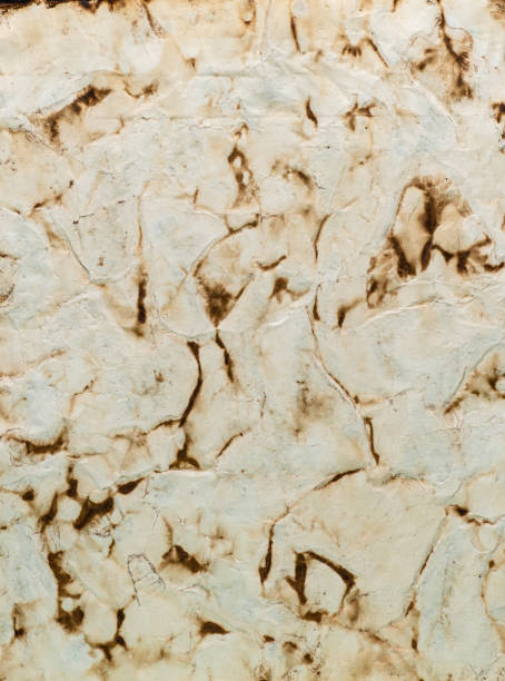 istock Yellow grunge ancient parchment paper. Old textured paper on table from above. Old witch book empty page. Paper for calligraphy memoir records and book making. Medieval manuscripts page. 1389363597