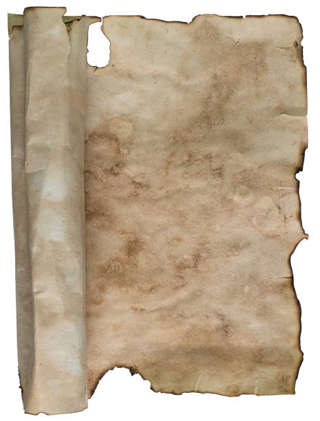 istock Medieval manuscript page or old burnt witchcraft scroll, top view. Magical concept for Halloween. Weathered spell book page. 1389363625
