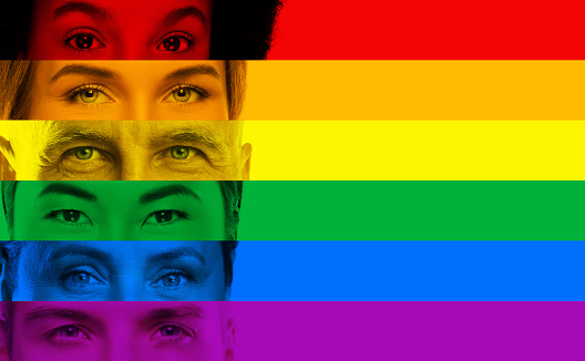 Close-up male and female eyes of different ethnicity and age in colors of LGBT community rainbow flag