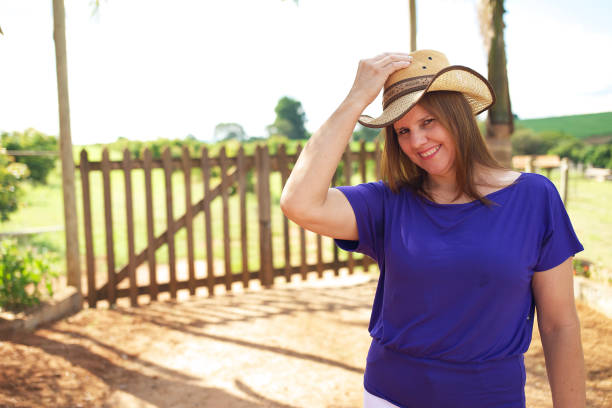 Portrait of a mature woman enjoying freedom and peace in her life, in a natural environment.