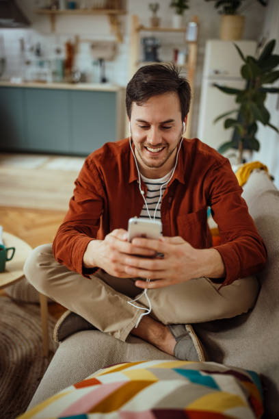 istock Young man talking over video call on smart phone at home 1389367538