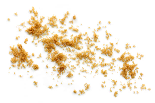 Raw Sugar Scattered Isolated on White Top View