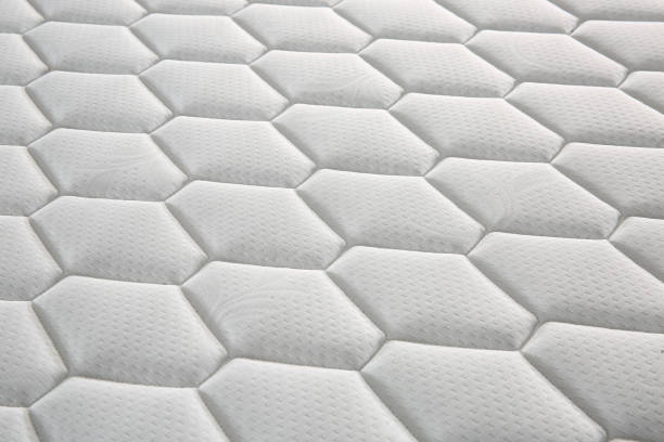 istock Closeup mattress texture background comfortable bed topper fabric bed sheet 1389371960