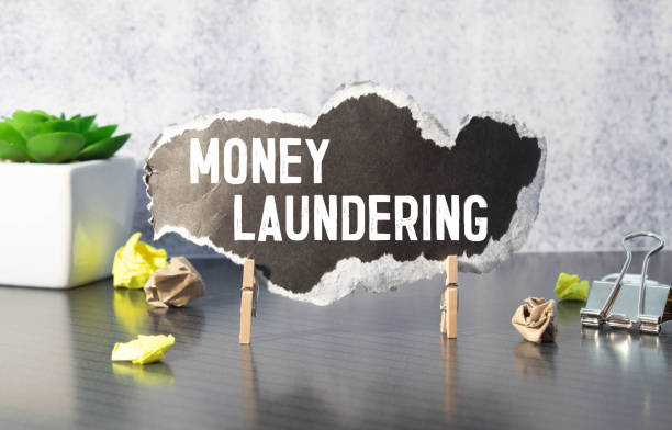 istock Hand underlining money laundering with red marker 1389373716