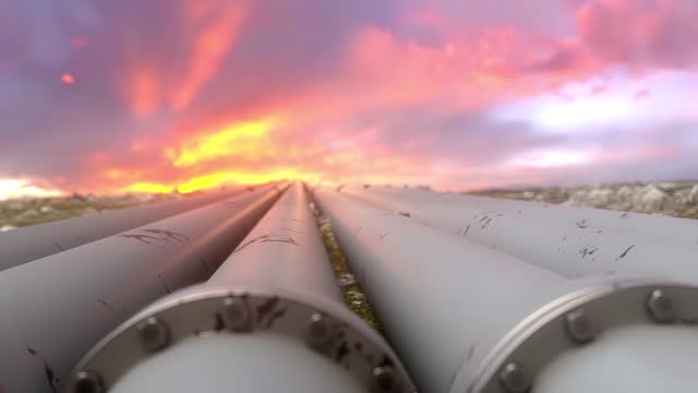 Industrial gas pipelines on sunset sky background.