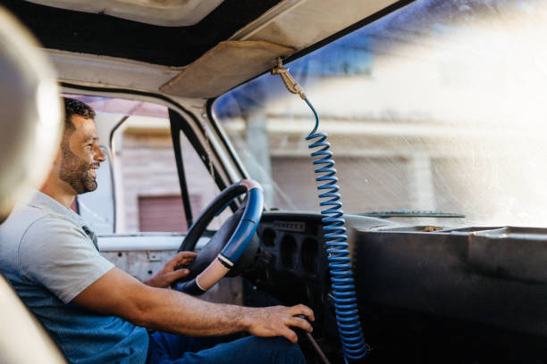 Driver in the truck at sunset