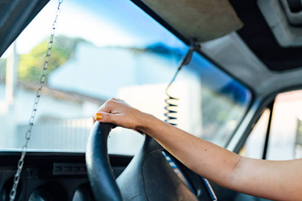 Female hand driving a truck