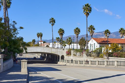 Santa Barbara, CA USA - February 2, 2022:  Interstate 101 passes over  State Street on this overpass in the Lower State neighborhood, a popular dining and tourist destination.