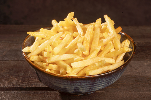 Fresh fried potatoes in white bowl