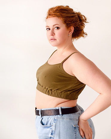 Studio shot of young red hair woman