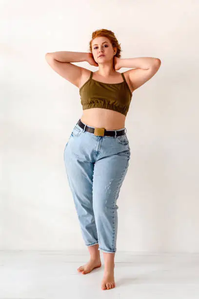 Studio shot of young red hair woman