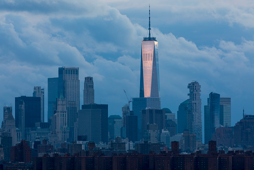 Dramatic view of the One World Trade Manhattan skyline in New York City.