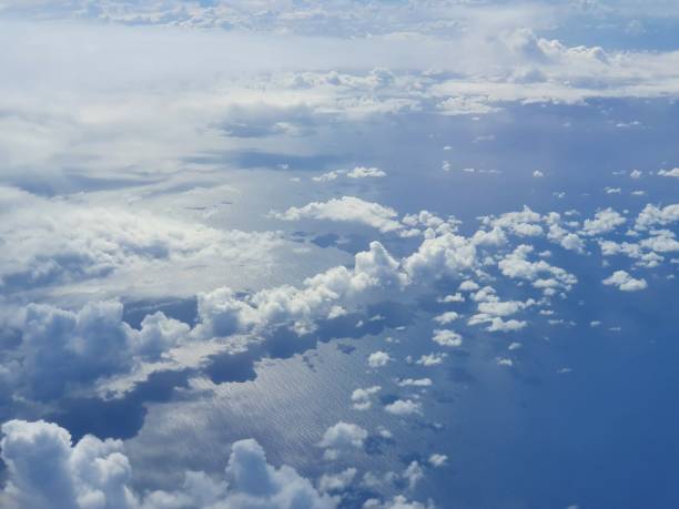 istock Clouds above the sea from bird's eye view 1389383454