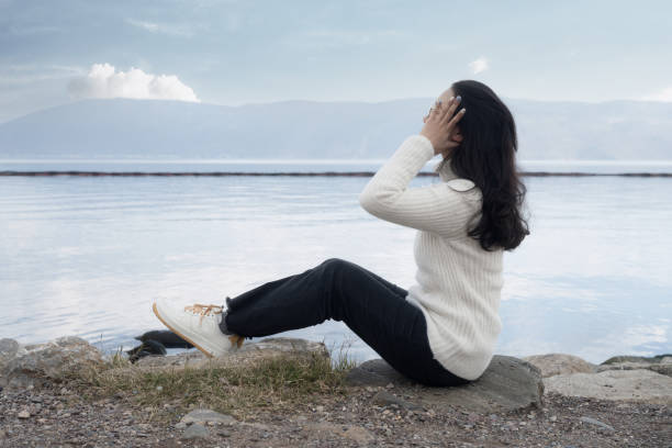 istock A girl blowing on the beach 1389388267