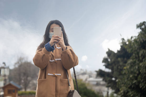 istock woman in a mask is traveling 1389388517
