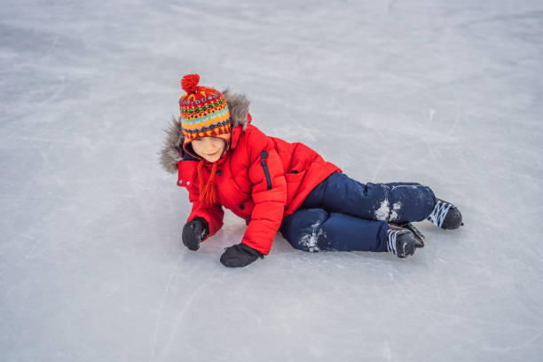 istock Boy ice skating for the first time 1389390379