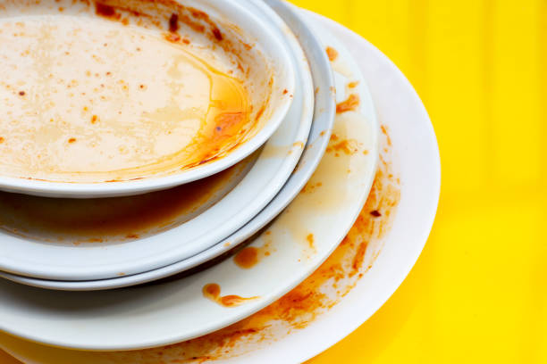 istock Dirty dish on yellow background. Top view 1389398011