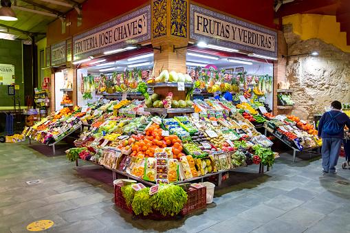 Portrait of a senior female retail clerk working at a greengrocer's shop