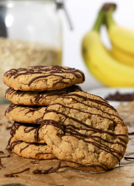close up of banana oatmeal cookies with chocolate chips on grey marble table