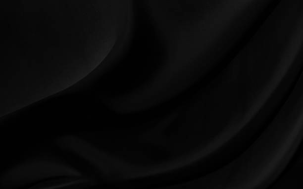 istock Black gray satin dark fabric texture luxurious shiny that is abstract silk cloth background with patterns soft waves blur beautiful. 1389402933