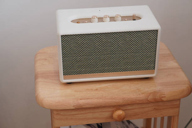 istock rectangular loudspeaker on wooden chair, white wall background, technology, object, fashion, modern, copy space 1389407796