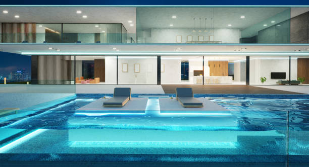 istock Modern villa with a swimming pool at night 1389409511