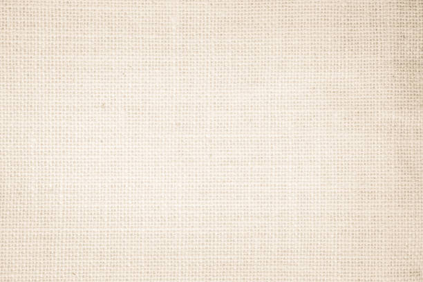 istock Jute hessian sackcloth burlap canvas woven texture background pattern in light beige cream brown color blank. Natural weaving fiber linen and cotton cloth texture as clean empty for decoration. 1389411705