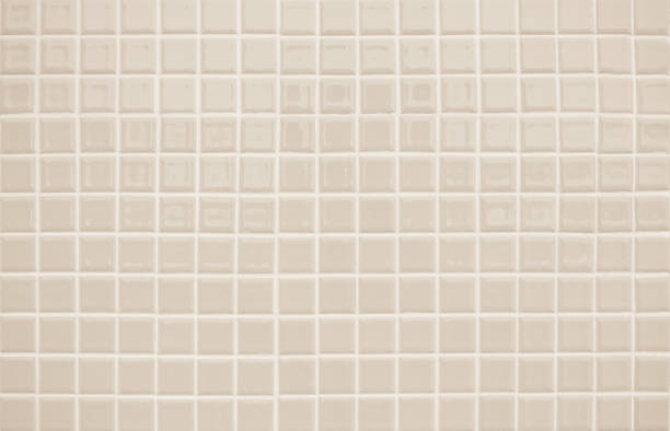 istock Beige ceramic wall and floor tile abstract background. Design geometric gray mosaic texture decoration of the bedroom. Simple seamless pattern grid for backdrop hospital wall, canteen and kitchen. 1389411871