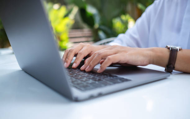 istock Closeup image of a woman working and typing on laptop computer keyboard 1389416716