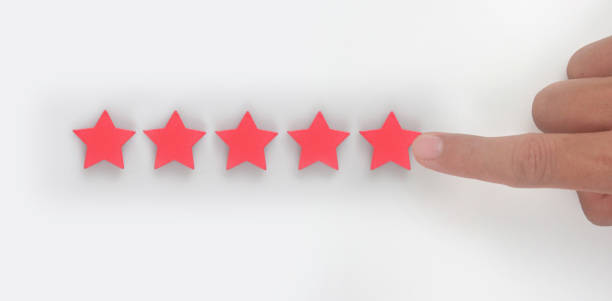 istock Rise on increasing five stars in human hand, Increase rating 1389417748
