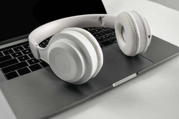 istock Computers and headphones on a white background 1389421998