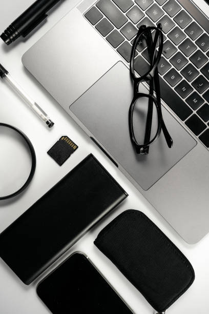 istock Computers, glasses, magnifying glasses, scissors, cards, clips and pens on a white background board 1389422141