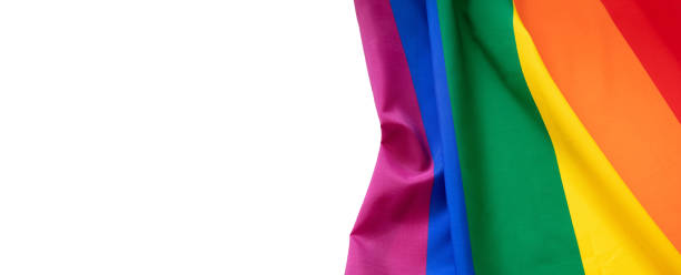 istock Rainbow colors textile on white background, copy space. LGBT Gay pride template, top view, banner. 1389423100